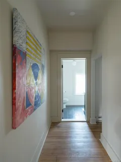 a view of an entryway with wooden floor