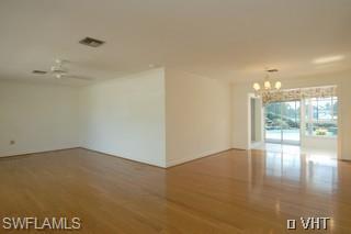 330 Springline Drive Naples, FL 34102 - Photo 2 of 8 a view of an empty room and window