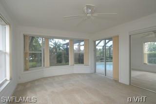 330 Springline Drive Naples, FL 34102 - Photo 5 of 8 a view of an empty room with a window