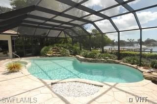330 Springline Drive Naples, FL 34102 - Photo 6 of 8 a view of a backyard