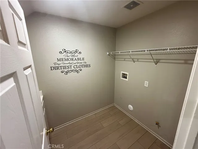 a view of storage and utility room with a washer dryer