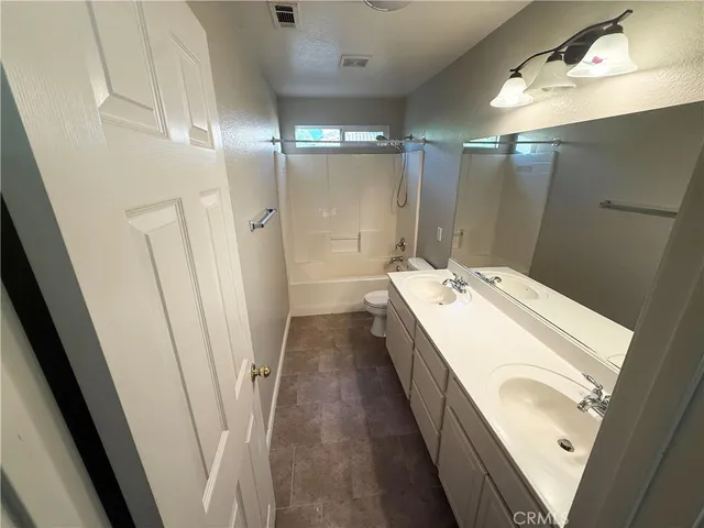 a bathroom with a sink a mirror and a shower