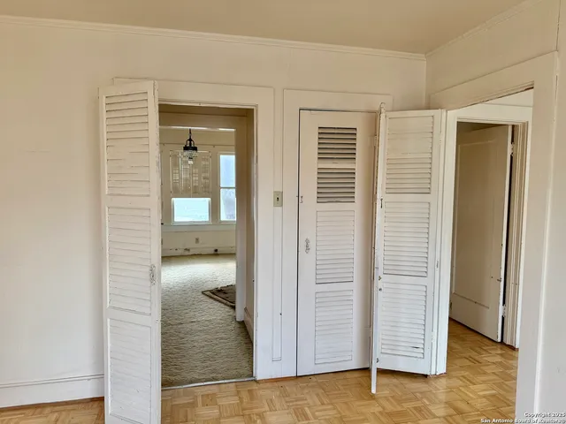 a view of an empty room with a window