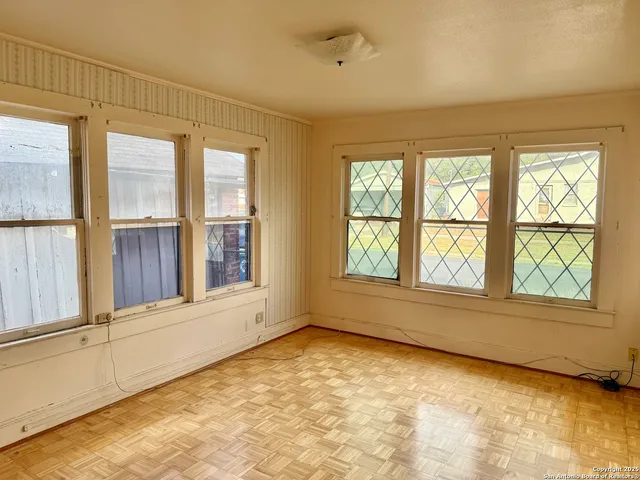 an empty room with windows