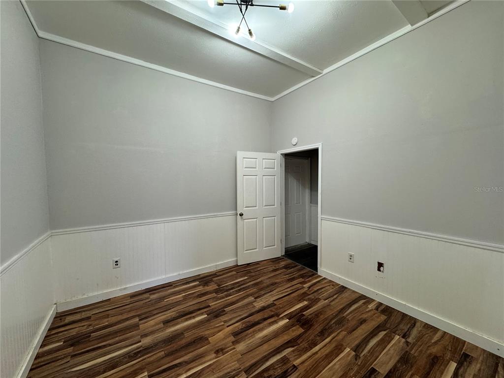 12349 Wasatch Court New Port Richey, FL 34654 - Photo 19 of 34 a bedroom with a bed and cabinets