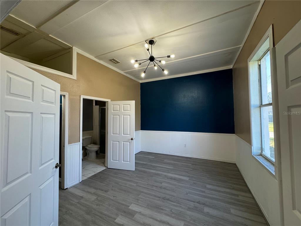 12349 Wasatch Court New Port Richey, FL 34654 - Photo 25 of 34 a view of livingroom with hardwood floor and hallway