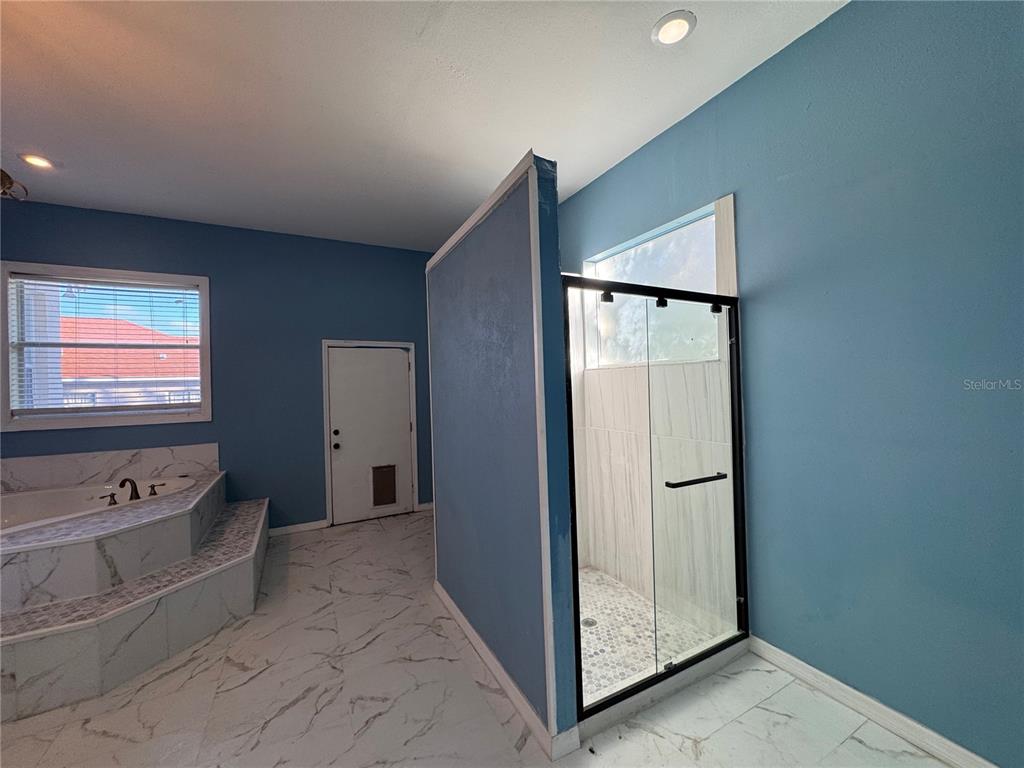 12349 Wasatch Court New Port Richey, FL 34654 - Photo 28 of 34 a view of room with window and a flat screen tv