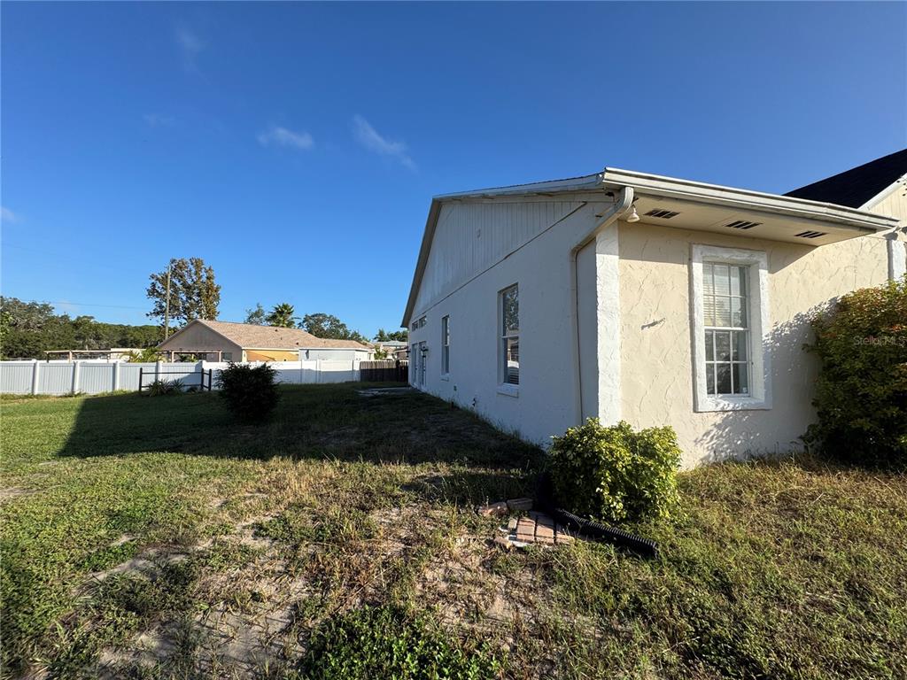 12349 Wasatch Court New Port Richey, FL 34654 - Photo 7 of 34 a front view of a house with garden