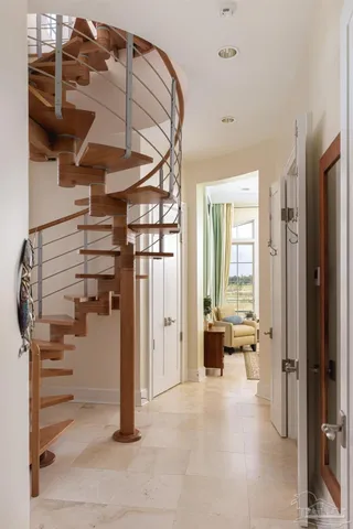 a bedroom with a bed couch and window