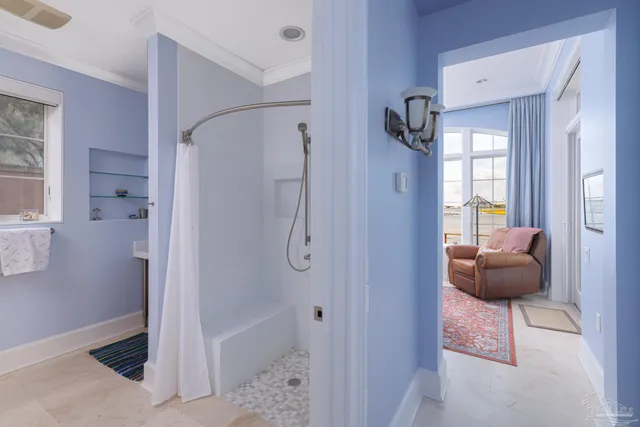 a white toilet sitting next to a bathroom sink