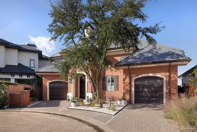 a front view of a house with yard
