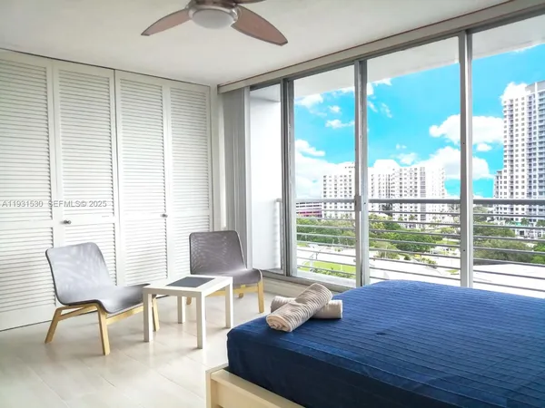 a living room with furniture and a window