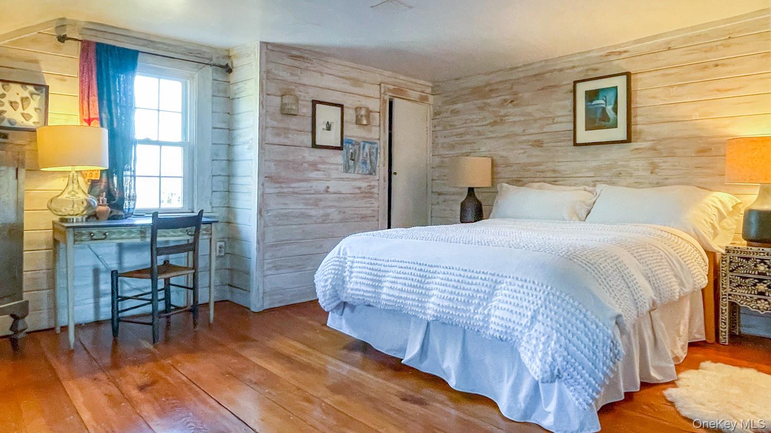 1201 Bruynswick Road Gardiner, NY 12525 - Photo 15 of 30 a bedroom with a bed and a table in it