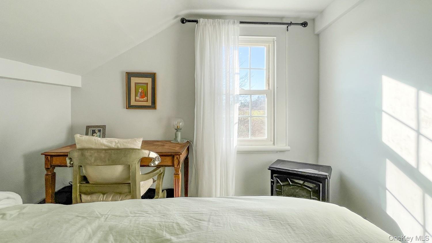 1201 Bruynswick Road Gardiner, NY 12525 - Photo 17 of 30 a bedroom with a bed and wooden floor