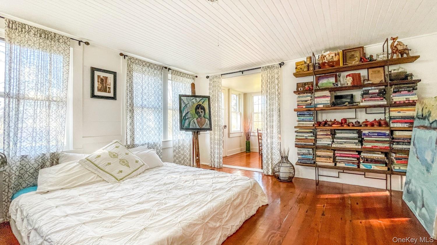 1201 Bruynswick Road Gardiner, NY 12525 - Photo 9 of 30 a bedroom with a bed and a book shelf