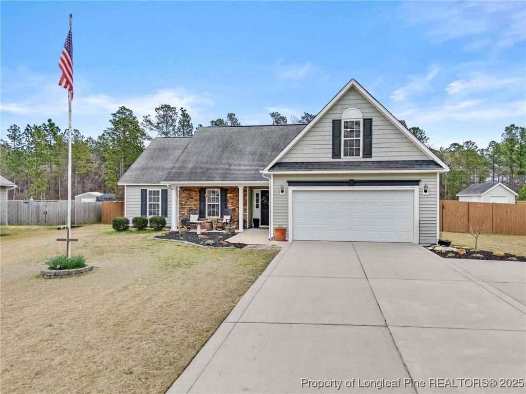 6657 Hillbrook Road Hope Mills, NC 28348 - Photo 1 of 50 a front view of a house with entertaining space