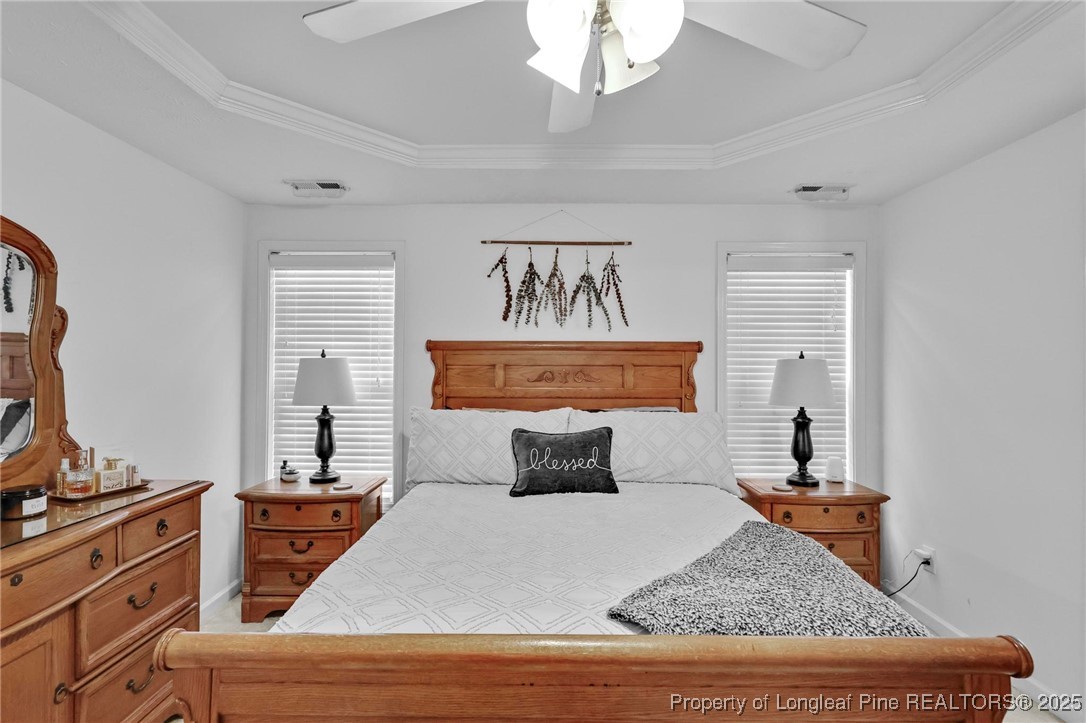 6657 Hillbrook Road Hope Mills, NC 28348 - Photo 16 of 50 a bedroom with a bed and wooden floor