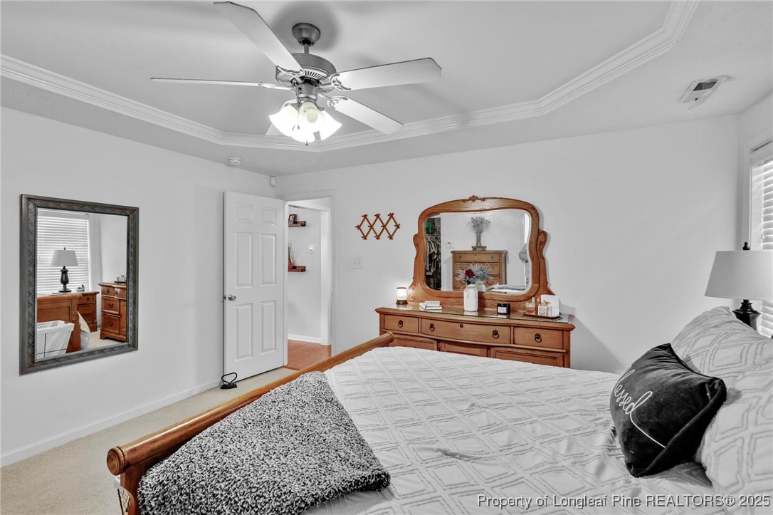 6657 Hillbrook Road Hope Mills, NC 28348 - Photo 19 of 50 a bedroom with a bed and window