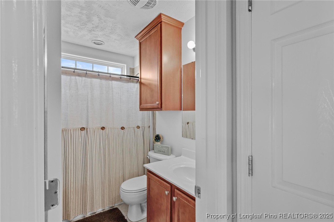 6657 Hillbrook Road Hope Mills, NC 28348 - Photo 29 of 50 a bathroom with a sink and toilet