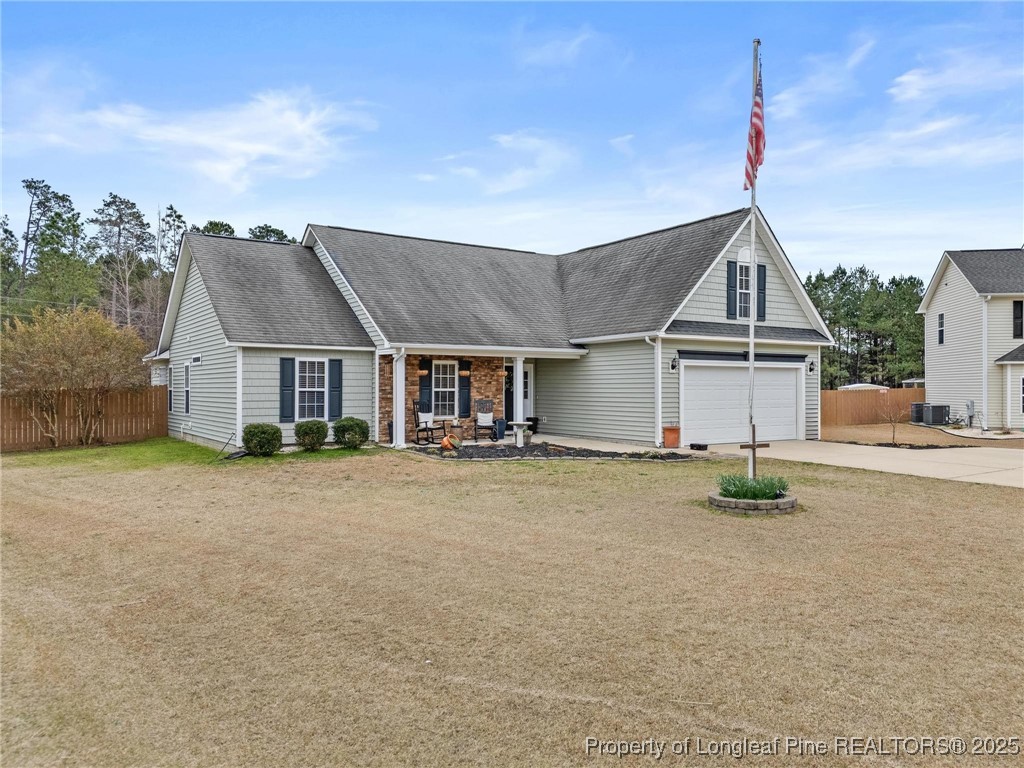6657 Hillbrook Road Hope Mills, NC 28348 - Photo 3 of 50 front view of a house with a street
