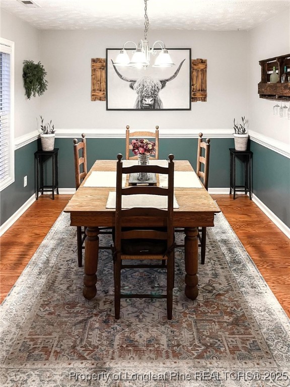6657 Hillbrook Road Hope Mills, NC 28348 - Photo 9 of 50 a dining room with a table and chairs