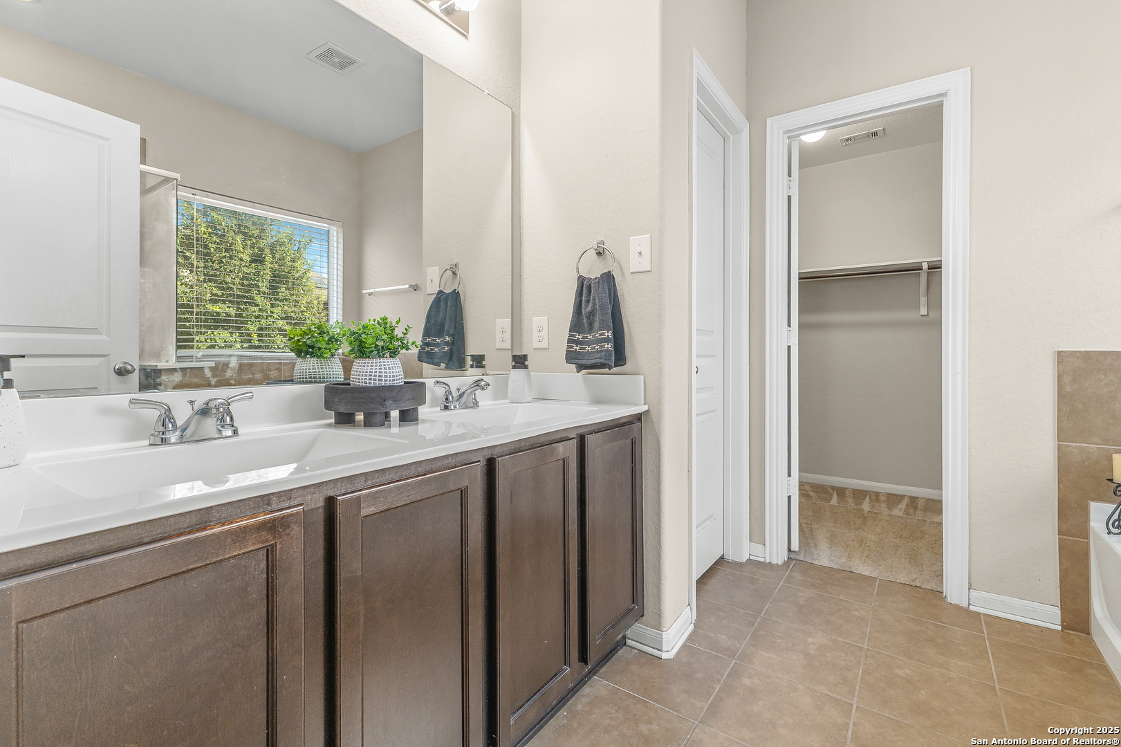 4402 Rucker Park Converse, TX 78109 - Photo 14 of 25 a bathroom with a sink and a mirror