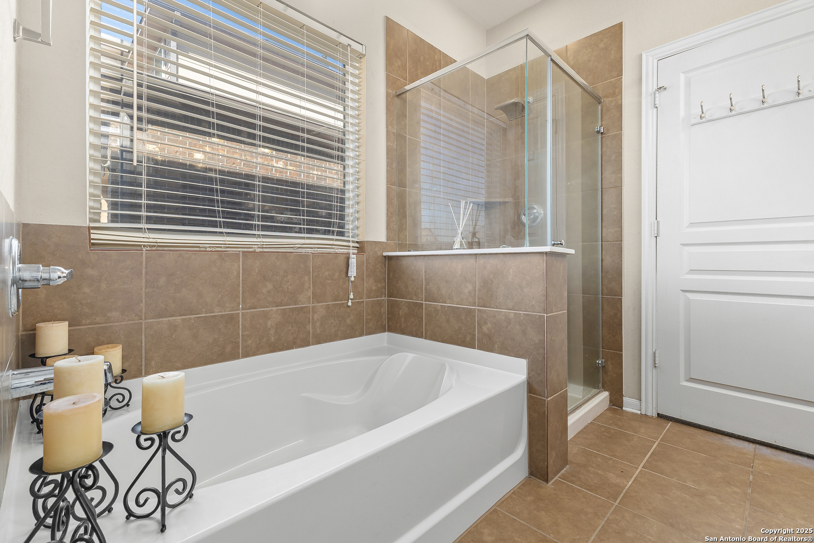 4402 Rucker Park Converse, TX 78109 - Photo 15 of 25 a bathroom with a bathtub and a shower