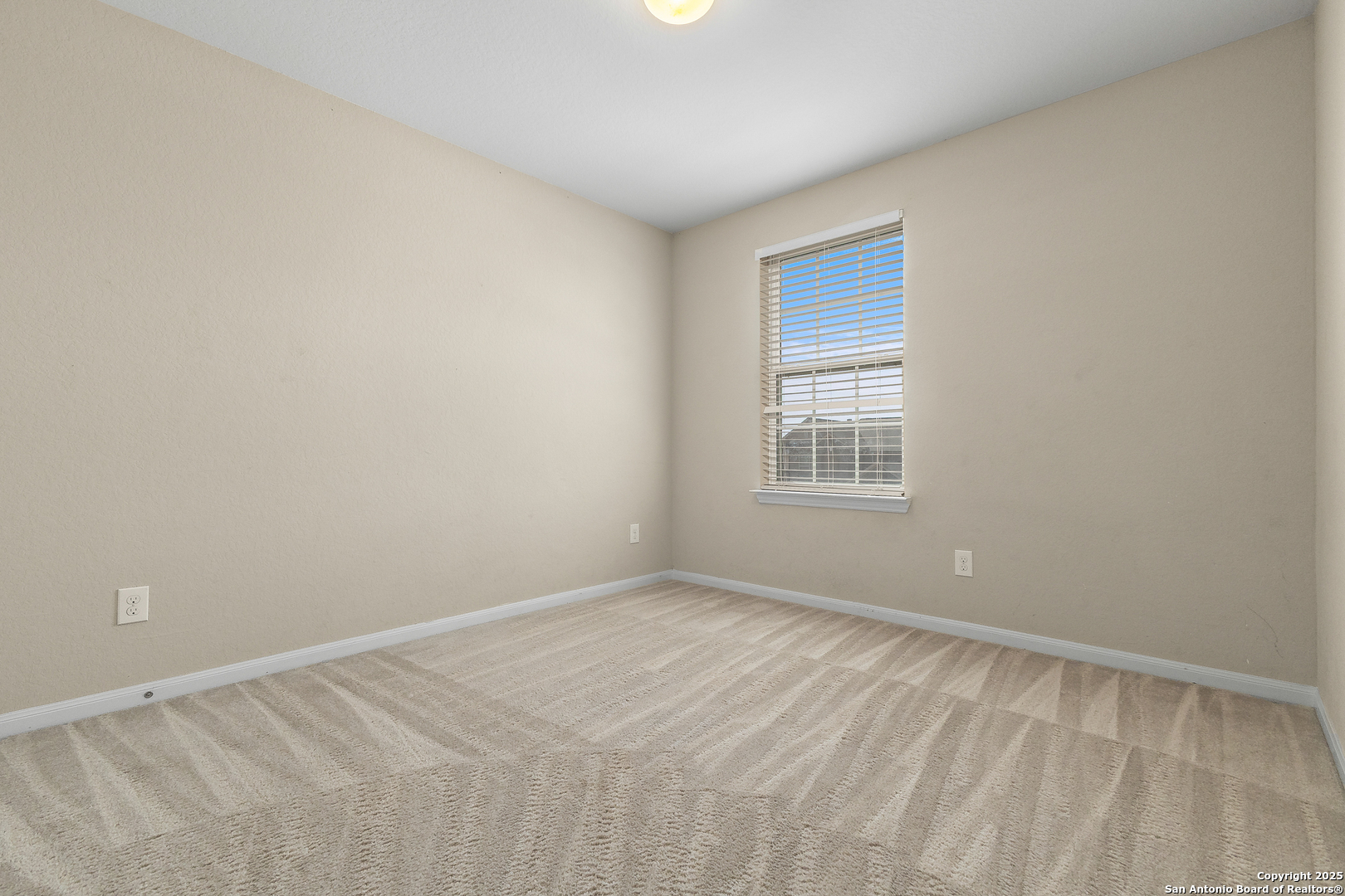 4402 Rucker Park Converse, TX 78109 - Photo 19 of 25 a view of an empty room with a window