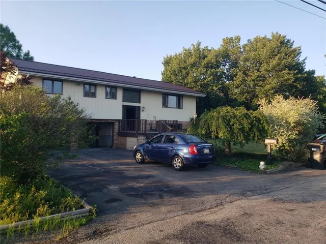 a car parked in front of a house
