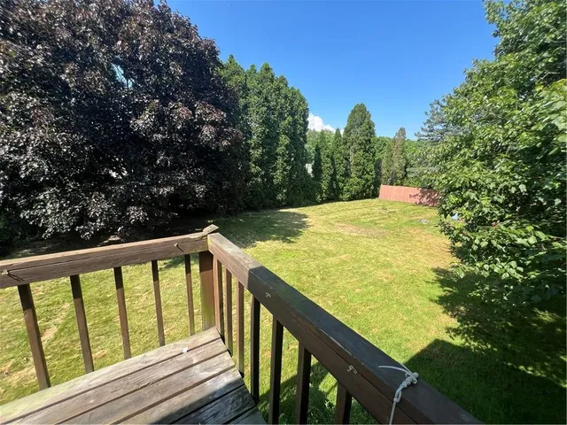 a view of swimming pool from a balcony