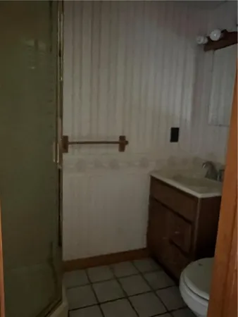 a bathroom with a toilet and a sink