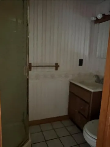 a bathroom with a toilet and a sink