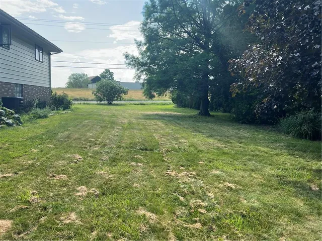 a view of a field with trees