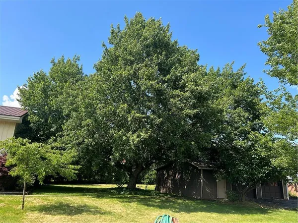 a view of a swimming pool with an outdoor space and seating area