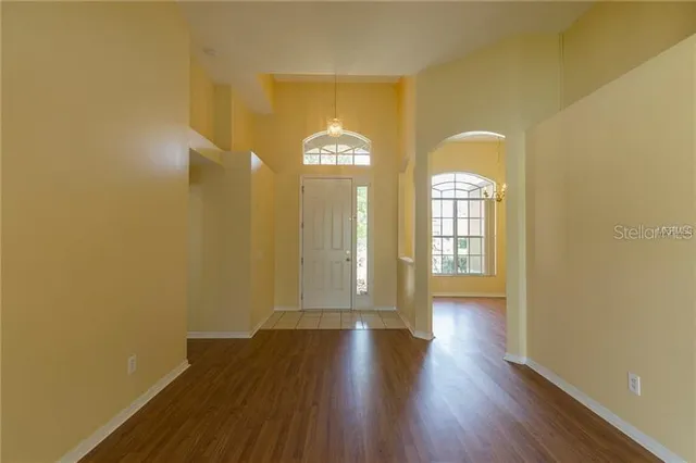 a view of entryway with wooden floor