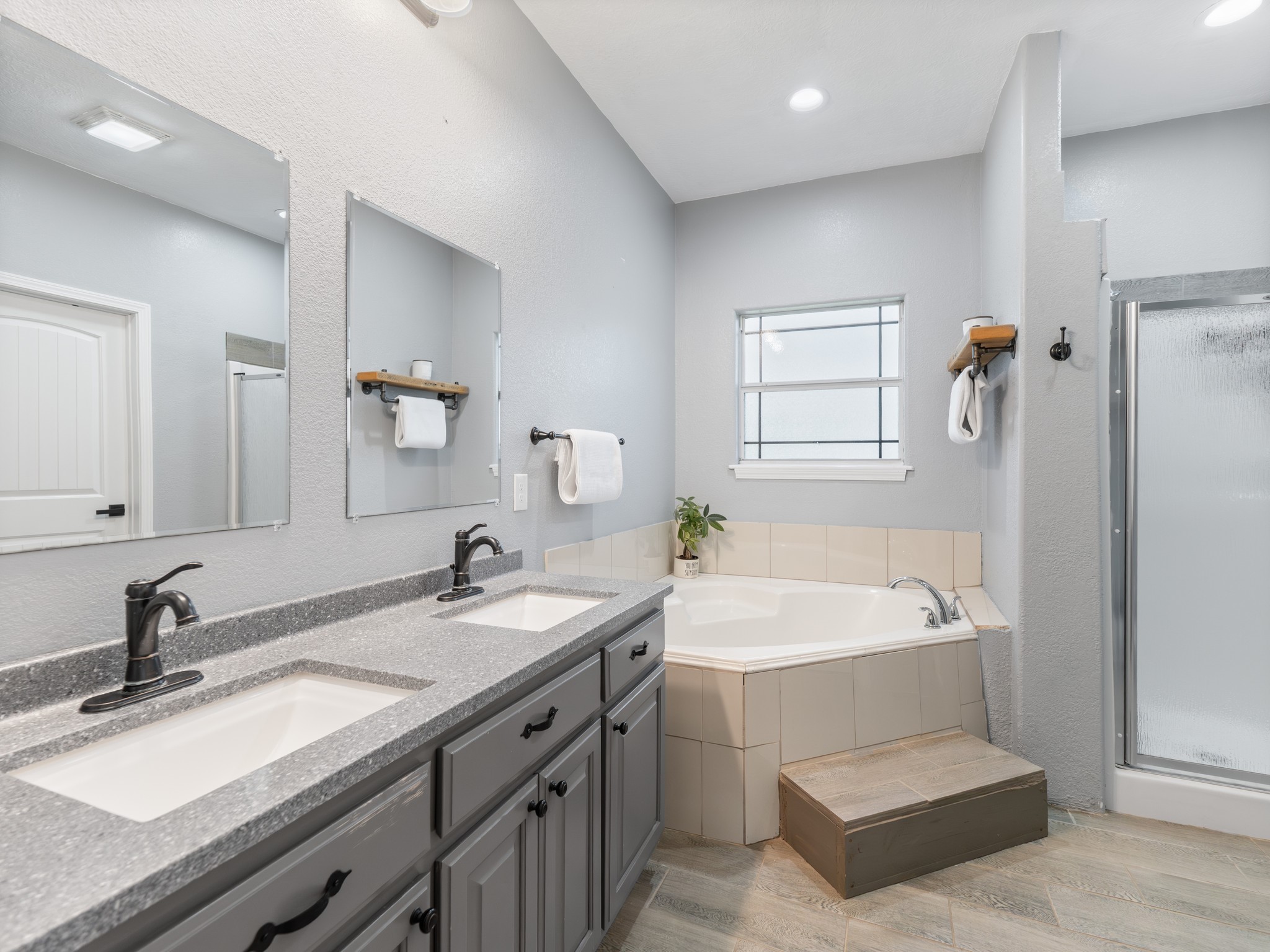 11301 South FM 441 Road El Campo, TX 77437 - Photo 12 of 32 The luxurious en-suite bath offers a retreat within the home. Large soaking tub to relax and unwind at the end of a busy day and super sized shower.