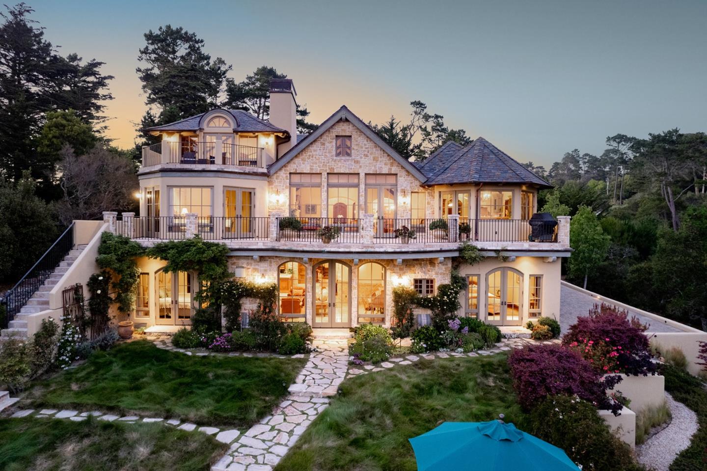 1606 Sonado Road Pebble Beach, CA 93953 - Photo 1 of 47 a front view of a house with a garden and plants