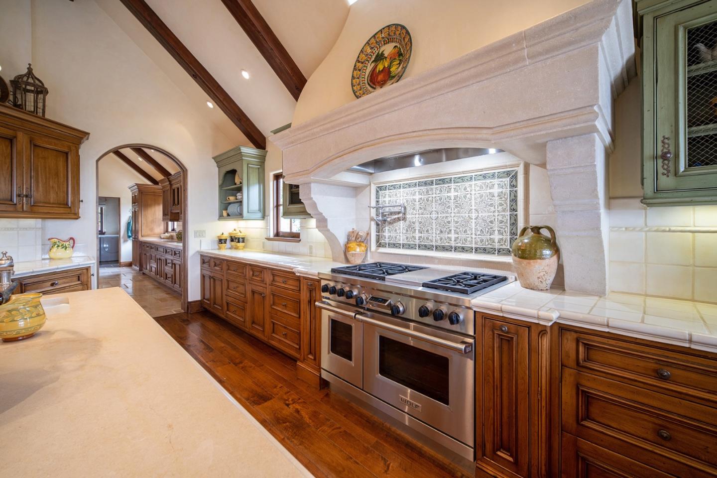 1606 Sonado Road Pebble Beach, CA 93953 - Photo 14 of 47 a kitchen with a stove and a sink