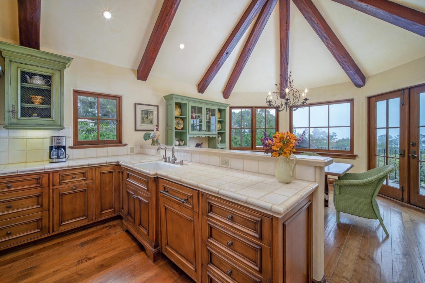 1606 Sonado Road Pebble Beach, CA 93953 - Photo 17 of 47 a kitchen with sink and cabinets