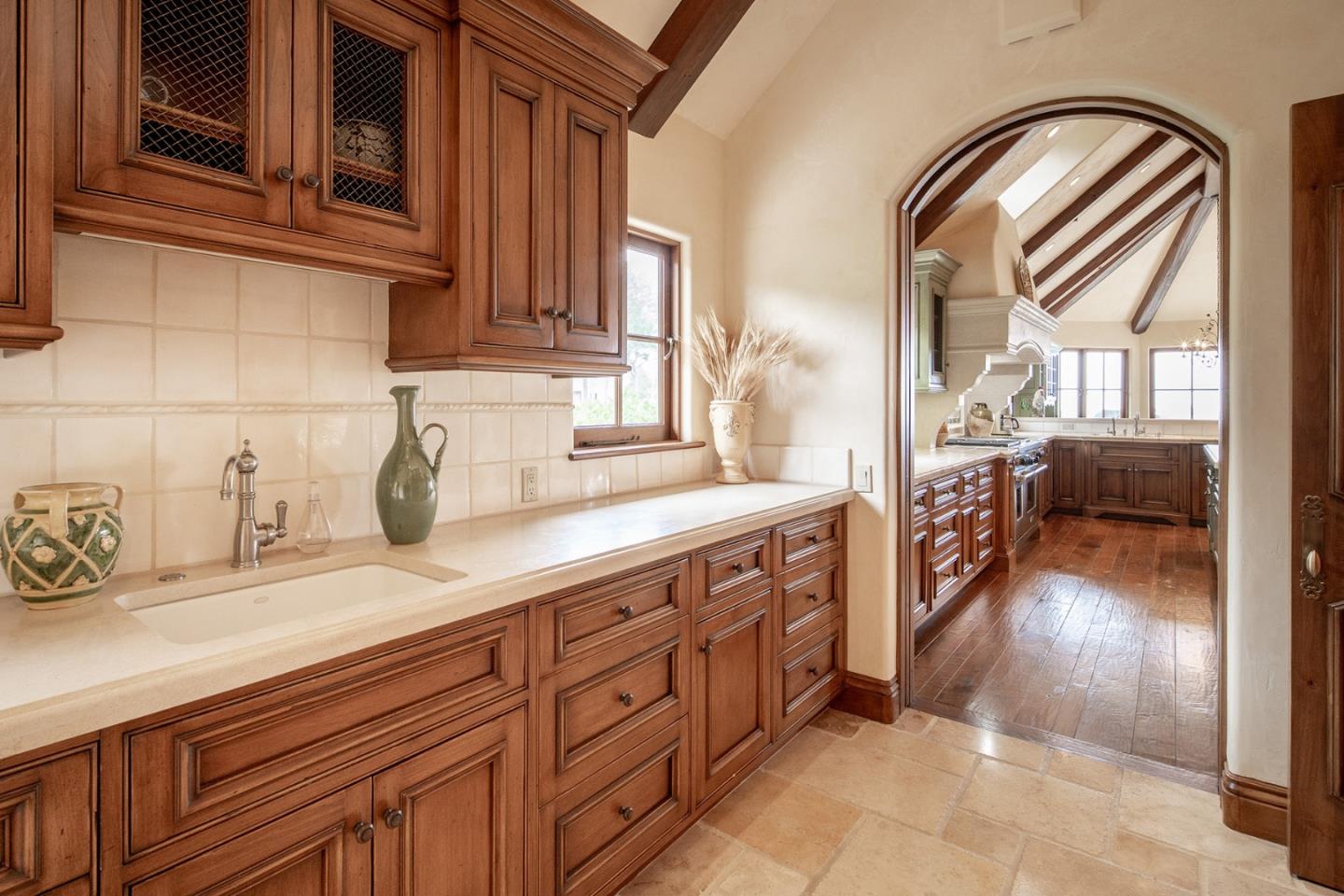 1606 Sonado Road Pebble Beach, CA 93953 - Photo 18 of 47 a kitchen with sink and cabinets