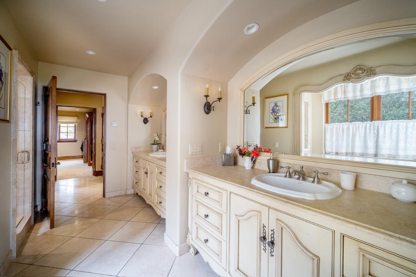 1606 Sonado Road Pebble Beach, CA 93953 - Photo 26 of 47 a spacious bathroom with a granite countertop sink mirror and a