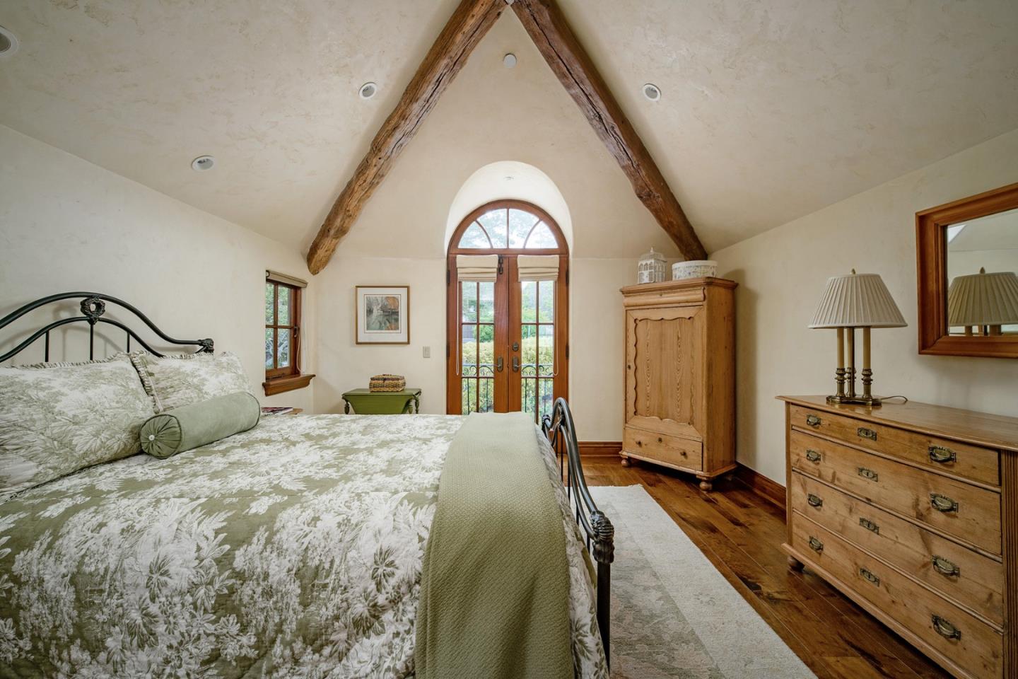 1606 Sonado Road Pebble Beach, CA 93953 - Photo 32 of 47 a bedroom with a bed and a dresser with mirror
