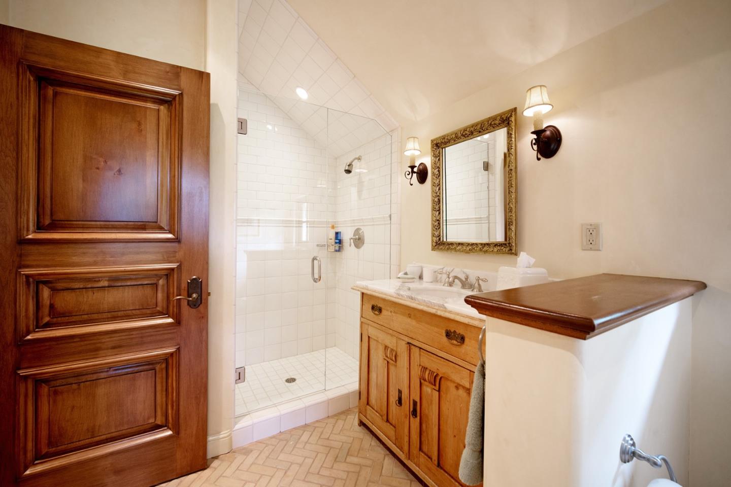 1606 Sonado Road Pebble Beach, CA 93953 - Photo 34 of 47 a kitchen with a refrigerator and a sink