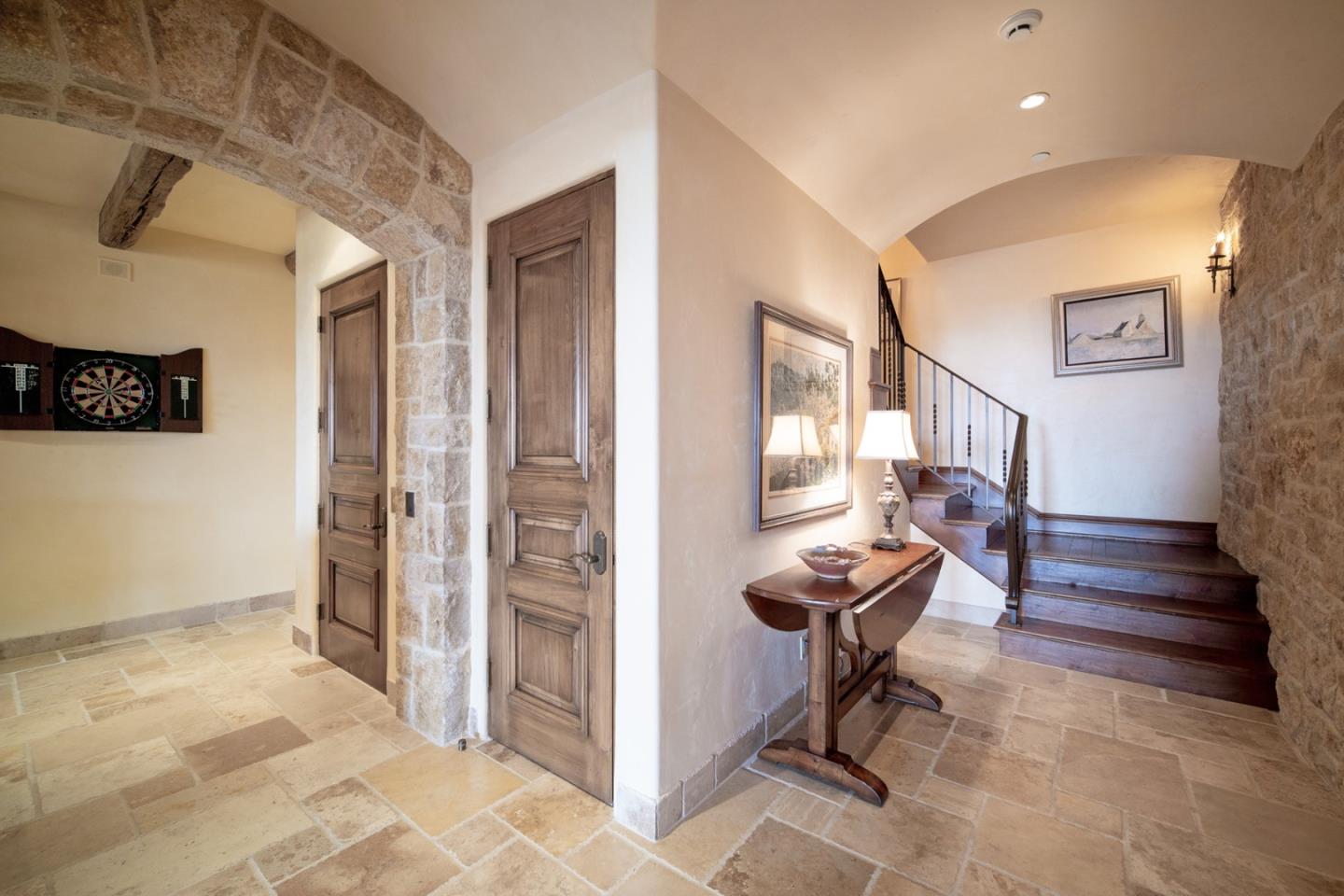 1606 Sonado Road Pebble Beach, CA 93953 - Photo 35 of 47 a view of a hallway with wooden floor and furniture