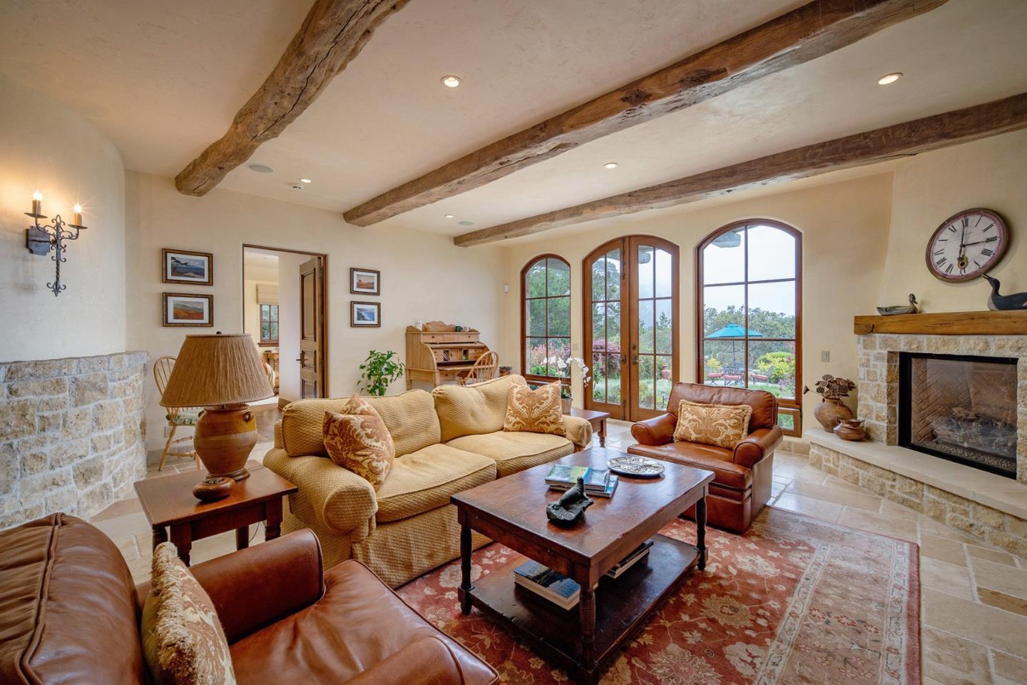 1606 Sonado Road Pebble Beach, CA 93953 - Photo 39 of 47 a living room with furniture a fireplace and a large window