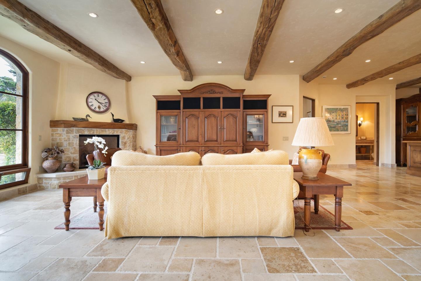 1606 Sonado Road Pebble Beach, CA 93953 - Photo 40 of 47 a living room with furniture a fireplace and a chandelier