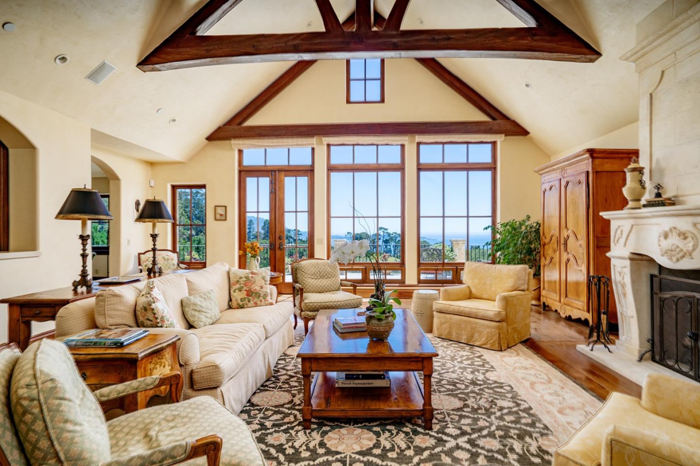 1606 Sonado Road Pebble Beach, CA 93953 - Photo 7 of 47 a living room with furniture fireplace and a large window