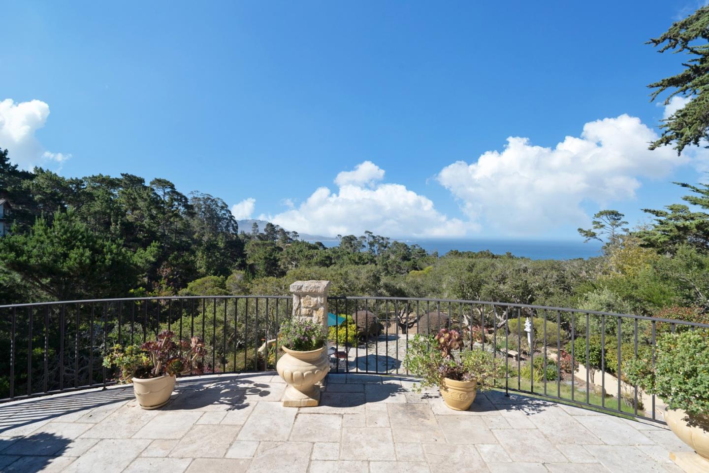 1606 Sonado Road Pebble Beach, CA 93953 - Photo 8 of 47 a view of a balcony with chair and potted plants