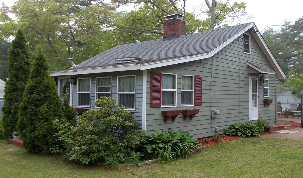 136 Barker Road Wareham, MA 02538 - Photo 3 of 13 a view of a house with a yard plants and large tree