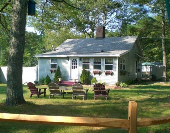 136 Barker Road Wareham, MA 02538 - Photo 4 of 13 a house view with a sitting space and garden